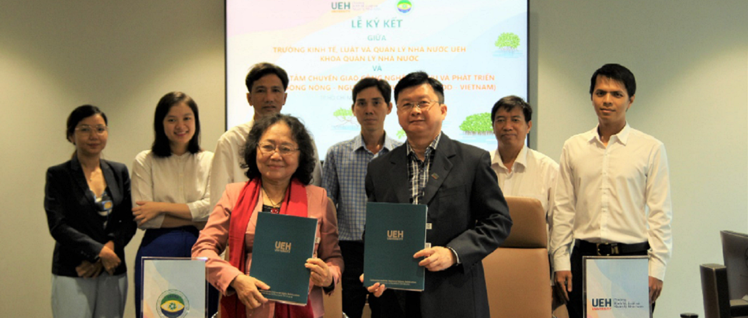 Signing cooperation agreement between UEH College of Economics, Law and Government and Center for Technology-Services and Community Development of Vietnamese Agriculture-Fisheries (FACOD-VIETNAM)